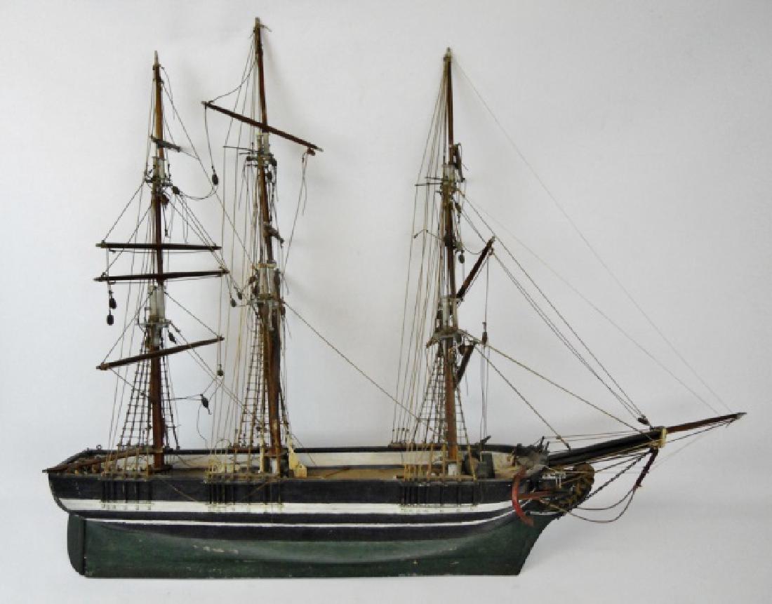 19th C. Model of a Three- Masted Sailing Ship: 19th C. hand crafted wooden model of a three-masted sailing ship. Hand carved and painted hull and rigging blocks with metal hardware and carved bone. Hull painted in green, black and white with movea