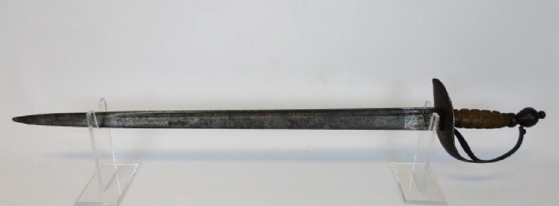 American Revolutionary War Navy Cutlass: Cutlass of American manufacture with a single fullured tapered steel blade. Steel cup guard with branch, (one period removed), carved wood ribbed grip and ball pommel. Overall light oxidation, pommel 