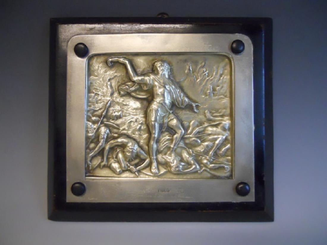 Silver Plaque, Sampson, Bezalel School, Palestine: Early 20th C. Bezalel school repousse silver plaque depicting Sampson slaying the Philistines, marked "MADE IN PALESTINE", with small Hebrew inscription. Plaque is mounted to wooden board. Measures 7.