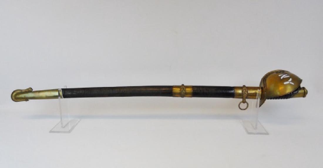 Civil War 1860 Navy Cutlass, SNY with Presentation: Model 1860 Navy Cutlass with "SNY" cut out brass guard leather grip and curved steel blade. Cutlass is housed in a leather and gilt brass Model 1852 Navy Officer sword scabbard, signed "AMES MFG Co, C