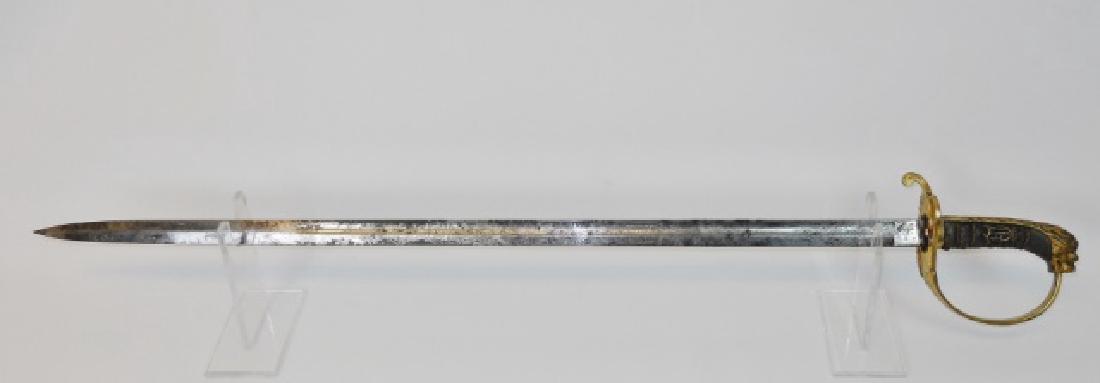 Model 1883 German Navy Officer's Sword: Model 1883 German Navy Officer's Sword, gilt cast brass guard with hinged plate, crowned anchor decoration with hand chased lion head. Wire wrapped shagreen grip with inset royal cypher. Single fuller