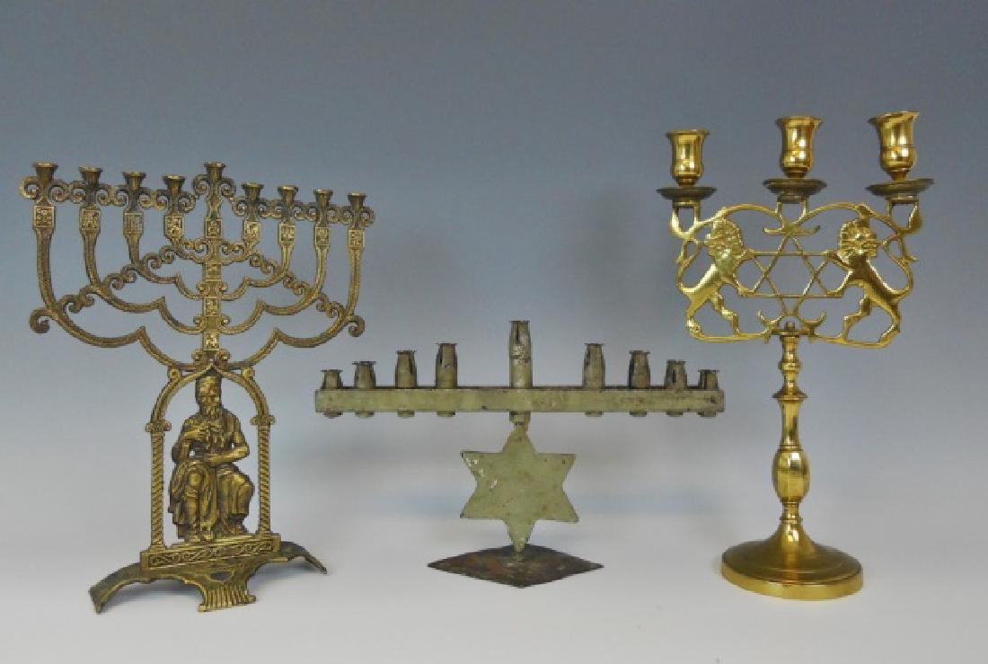 Late 19th C - 20th C Candelabrum (3pc): Three candelabrum: (1) Brass, Israeli Hanukkah lamp,13" H, 7" W, c.1970, (1) Trench Art Menorah hand-fashioned in Israel from bullet casings, mid to late 20th C., 8" H, 14.2" W, patina, (1) Bronze Sab