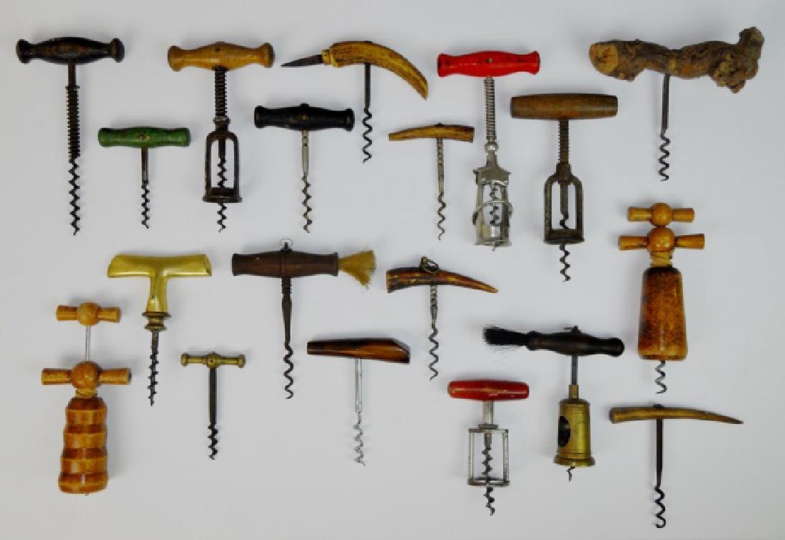 Collection of Antique Cork Screws, (18pc): Eighteen 19th-20th C. cork screws. Handles in wood, brass, horn and Bakelite in a variety of styles and motifs.