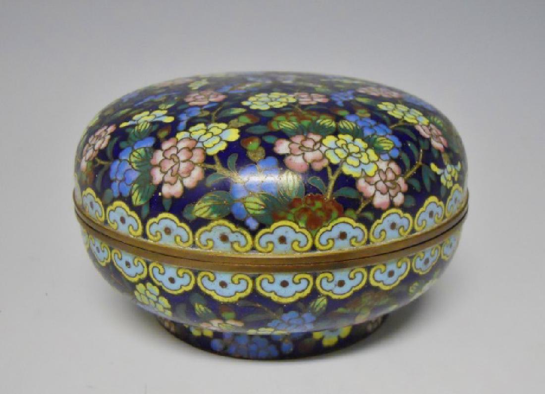 Antique Chinese Cloisonne Round Box: Lidded gilt copper body box with high quality cloisonne decoration consisting of floral and butterfly design, with Ruyie border. Box measures: 2.75" H x 4.75" W.