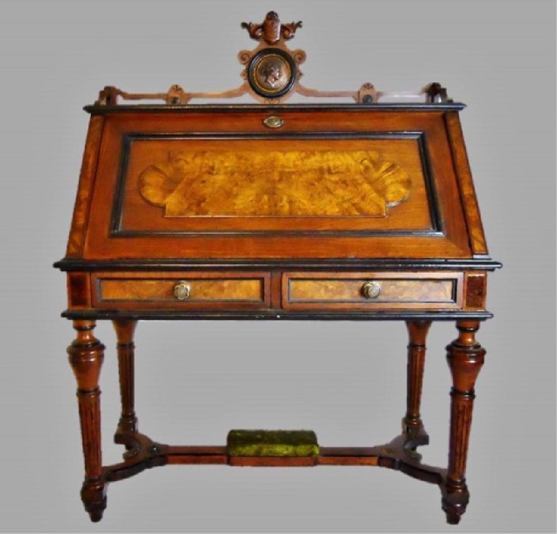19th C. English East Lake Burl Drop Front Desk: 19th C. English Eastlake drop front desk in Walnut, Oak and Burl. Case with ebonized decoration and burl embellishment surmounted by carved crest rail with inset copper medallion with neo-classical fe