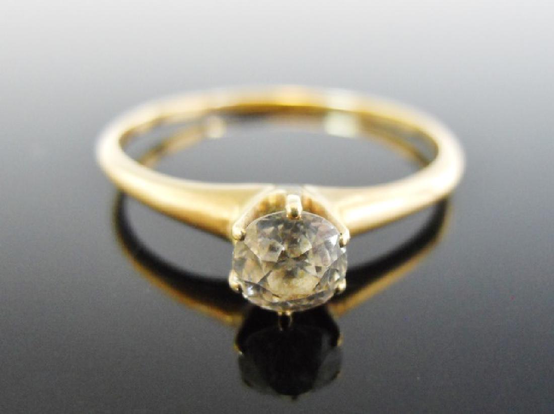 14K Gold Diamond Solitaire Ring: Ladies' 14K yellow gold diamond solitaire engagement ring. Center stone, modern round brilliant cut approximately .5 ct. Ring sized 8.5, Total weight: .8 dwt, 1.3 g.