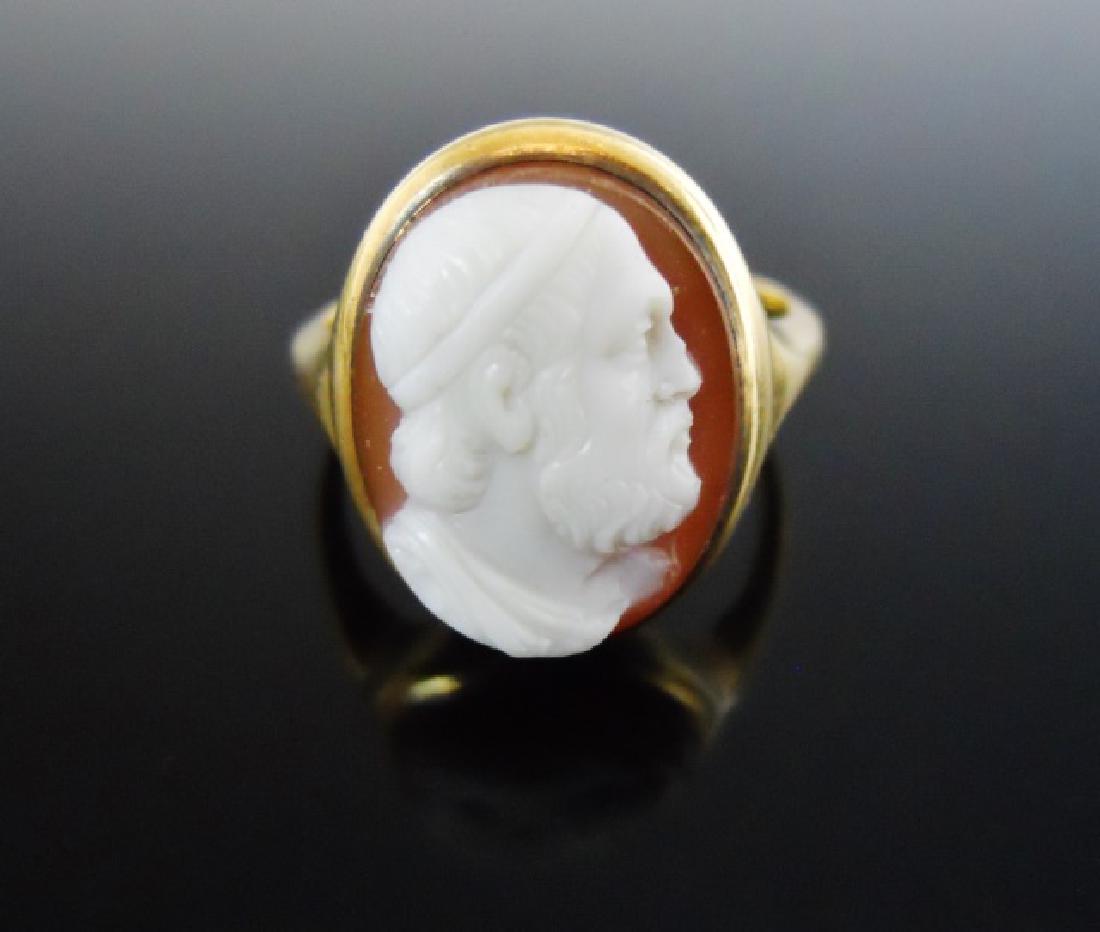14K Gold Carved Shell Cameo Ring: 14K yellow gold ring set with carved shell cameo of male neoclassical portrait in profile. Ring size 7, Total weight: 3.7 dwt, 5.6 g.
