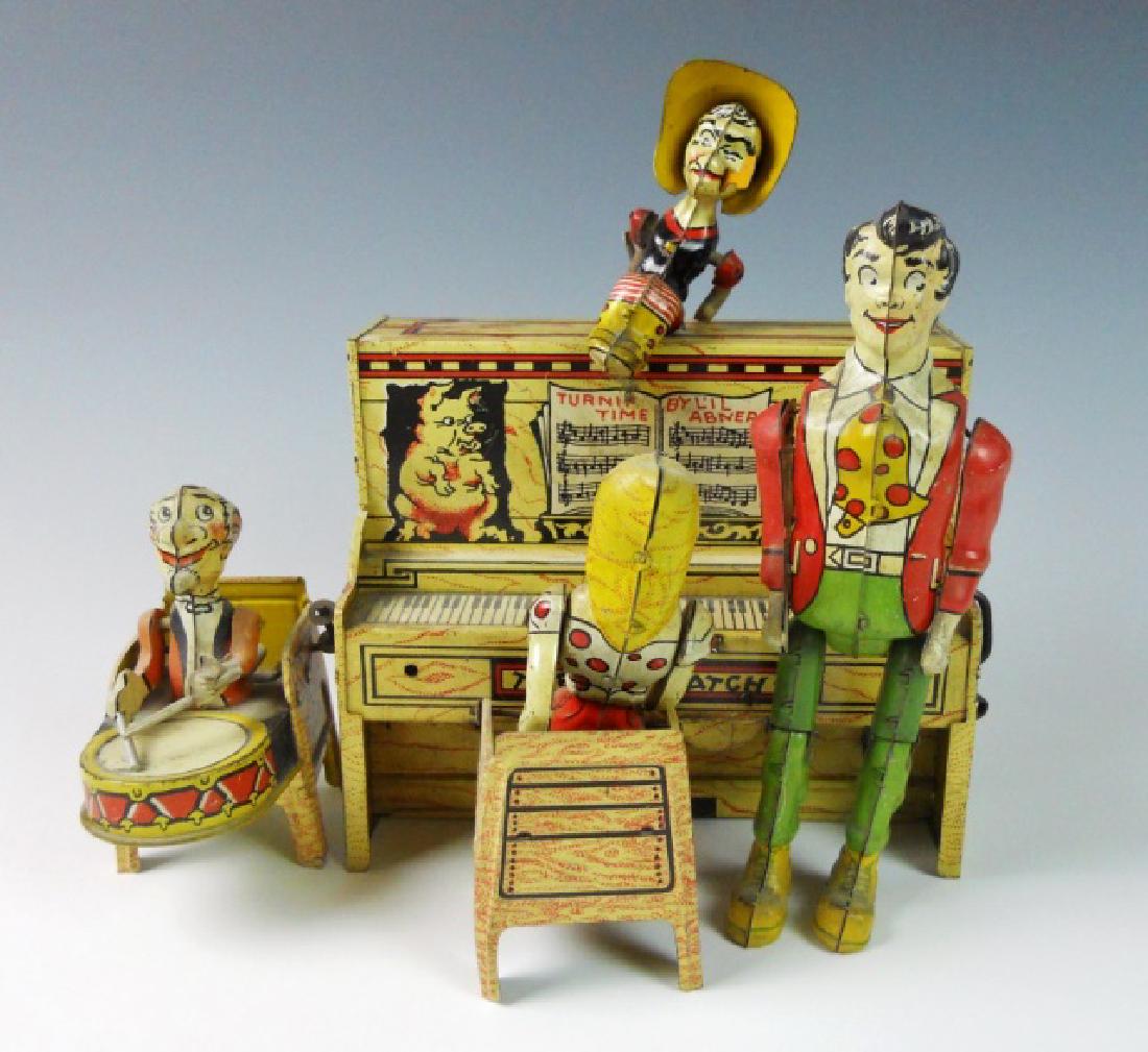 1940's "L'il Abner" Tin Litho Mechanical Toy: Tin litho mechanical toy, "Tunin' Time by L'il Abner" signed, "Unique Art Manufacturing Co" with 1945 Copyright date. Key wing mechanical function. All pieces present and complete, partial function. M