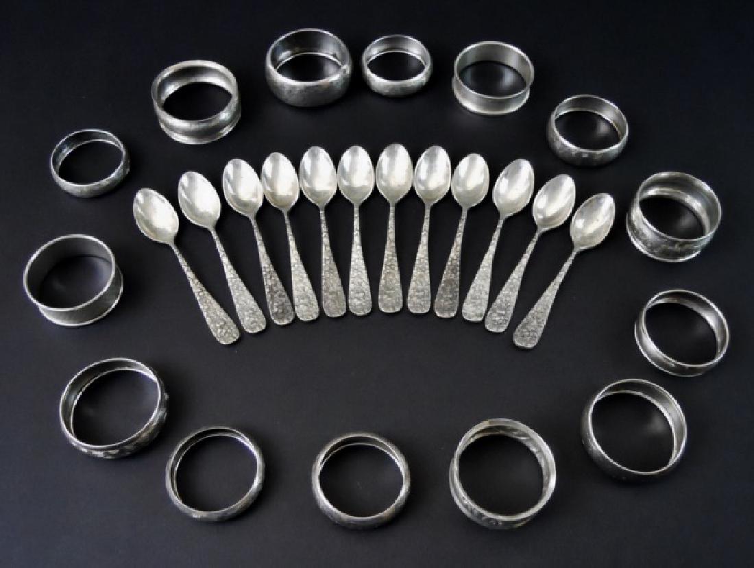 Collection of Sterling Silver Items, (26pc): Collection of English sterling silver and continental silver: (14) Mixed sterling silver napkin rings, many hand chased and repousse decorated, (12) Sterling silver demitasse spoons. Total weight: 8.6
