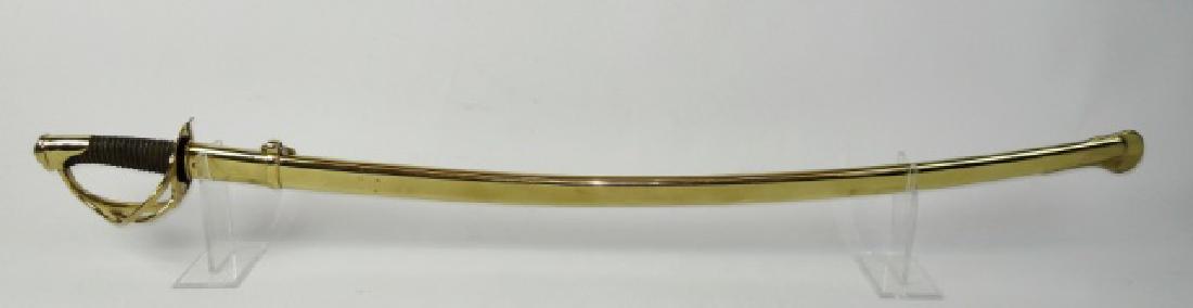 French Model 1822 Cavalry Sword, 1878 Date: French model 1822 cavalry sword, spine dated , "Jun 1878". Three branch gilt brass guard with wire wrapped leather grip and single fullered curved steel blade. Scabbard gilt steel with suspension ring