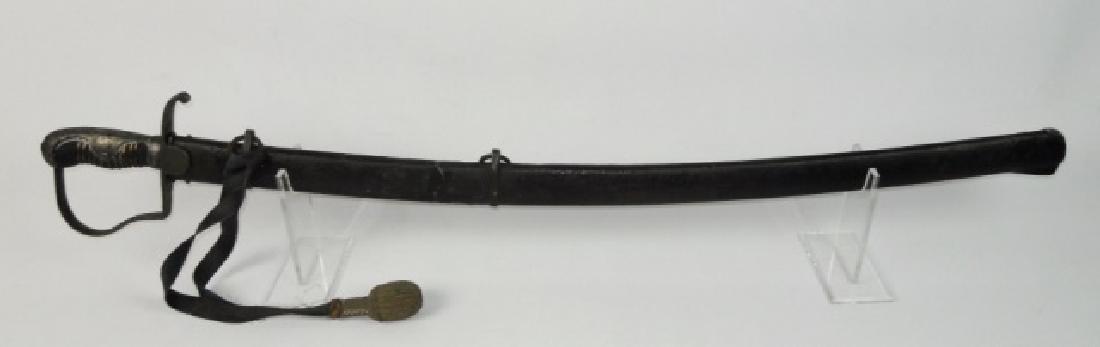 19th C. German Blucher Blade Cavalry Sword: Early 19th C. German "Blucher" cavalry sword. Steel stirrup guard with langets and wire wrapped leather grip. Curved steel single edged fullered blade. Steel scabbard in black paint. Sword measures: 3