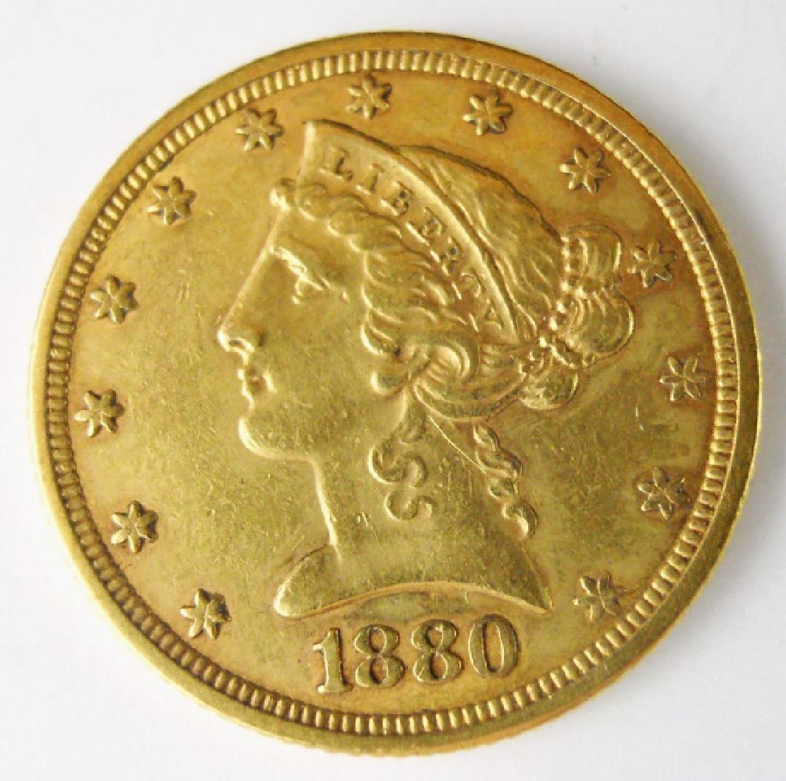 1880 US Liberty Head $5.00 Gold Coin: 1880 Liberty half eagle five dollar gold coin in circulated condition. Weight: 8.4 g