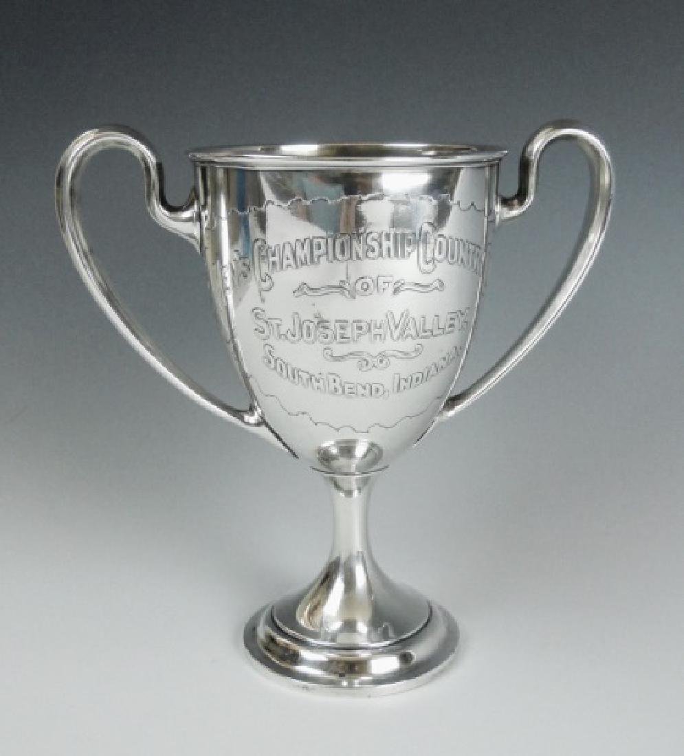 Sterling Trophy, St. Joseph Valley Golf, 1902: Sterling silver two handled golf trophy engraved in relief, "MEN'S CHAMPIONSHIP COUNTRY CLUB OF ST. JOSEPH VALLEY, SOUTH BEND INDIANA" Reverse engraved "WINNER 1902-1905 E. H AHARA". Base with Gorham 