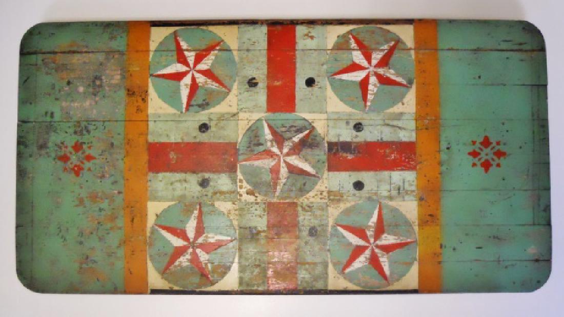 19th C. Cutting Table in Period Folk Art Paint: 19th C. folding cutting table with folk art painted top. Board top with interesting star and geometric design in green, red white and orange, legs painted red. Wear consistent with age and use, measur