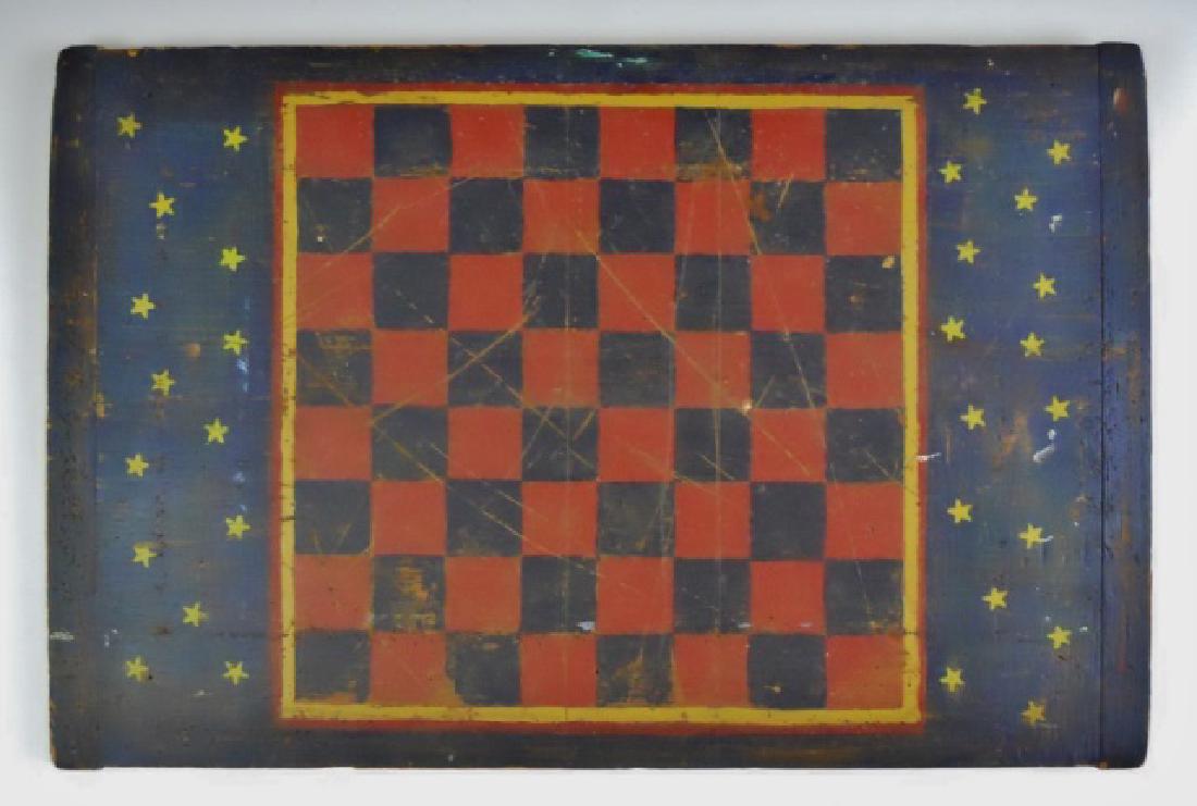 Antique Folk Art Game Board in Old Paint: 19th C. wood breadboard, hand painted with checkerboard in blue, red and gold. Wear to painted surface with scattered powder post beetle holes. Board measures: 14.5" H x 22" L