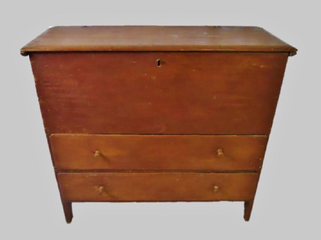 18th C. New England Blanket Chest in Old Paint: 18th C. New England pine blanket chest in old ox blood painted surfaces. Hinged top with two drawers, carved base. Chest measures: 37" H x 41" W x 15.5" D