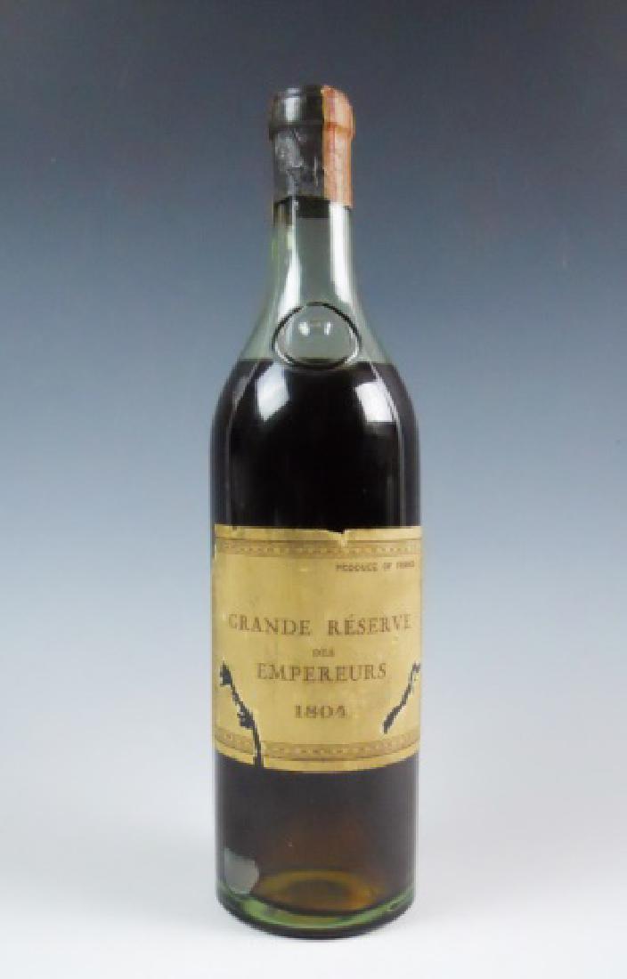Bottle Cognac, Grande Reserve des Empereurs 1804: Sealed and unopened bottle of Cognac, label reads "GRANDE RESERVE DES EMPEREURS 1804", reverse label reads, "1804 Importer KRAUS BROS & Co Inc. Sale Agents for United States 18 West 18th St. New York,