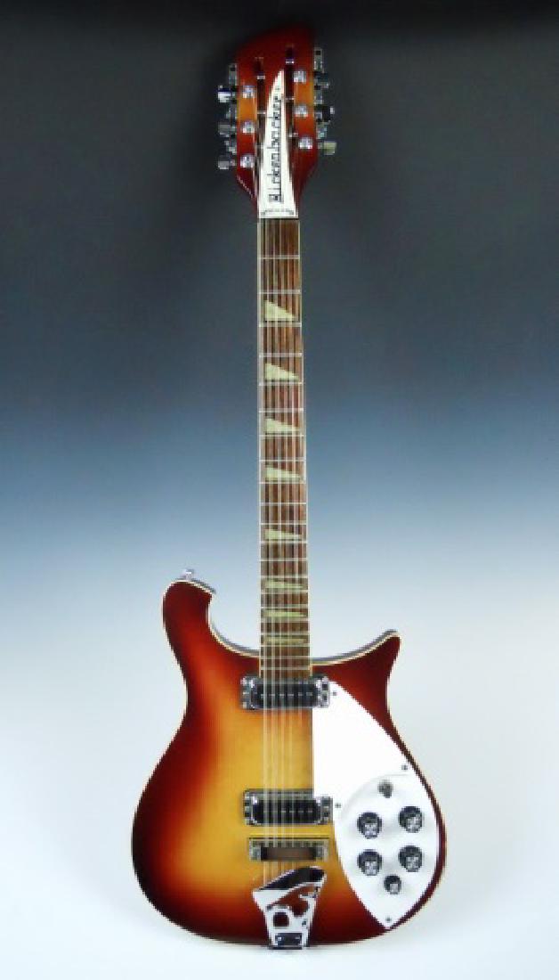1987 Rickenbacker #66012 String Electric Guitar: Electric guitar manufactured in 1987, Rickenbacker, model 660. Guitar body in "Fire Glow" finish with dual jacks and "Rick O' Sound" pickups. Guitar in excellent condition.