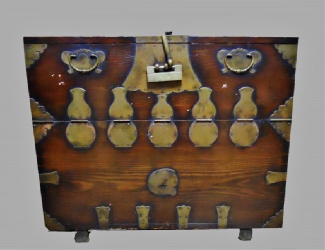 Japanese Meiji Period Tansu Chest: Japanese Meiji Period tansu chest. Brass bound wood construction with hinged front, revealing fitted interior desk and storage. Large period brass lock included. Measures: 38.5" H x 45.5" W x 20" D