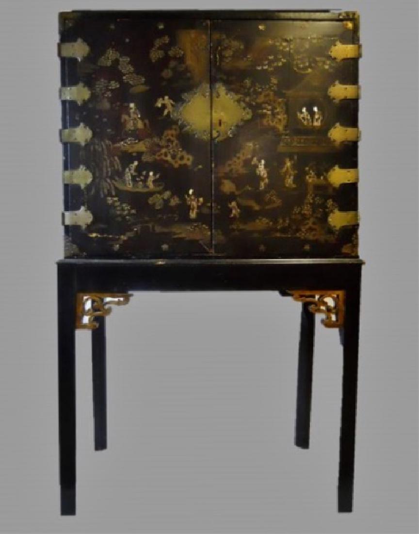 Japanese Meiji Period Lacquer Chest on Stand: Japanese Meiji Period lacquer chest on stand with hand painted gilt and mother of pearl decoration in the form of traditional landscape, floral and temple scenes. Chest with hinged and locking cabinet