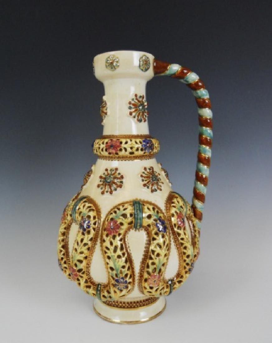 19th C. Porcelain Ewer, Fischer J. Budapest: Late 19th C. reticulated, glazed earthenware ewer with both impressed and blue stamp marks and impressed number 1323. Overall good condition with no obvious cracks, flakes or chips. Crazing as expecte