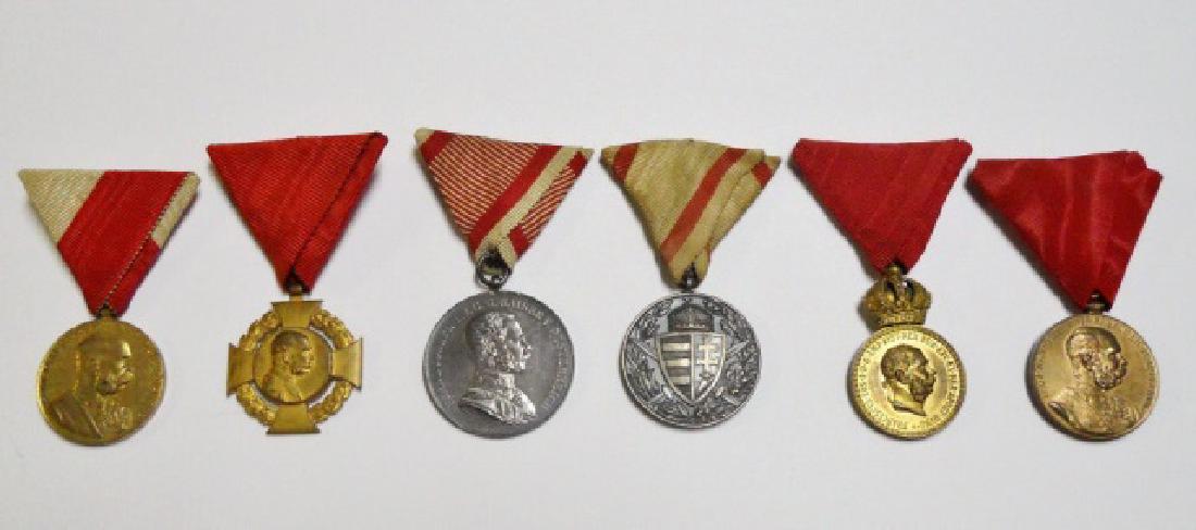 Six Austrian WWI Military Medals, (6pc): Collection of six World War One Austrian military medals: (1) Austria Tapferkeit Medal, die struck silver with silk ribbon, (1) Austria Pro Deo Patria Medal, die struck with ribbon, (2) Austria Signum