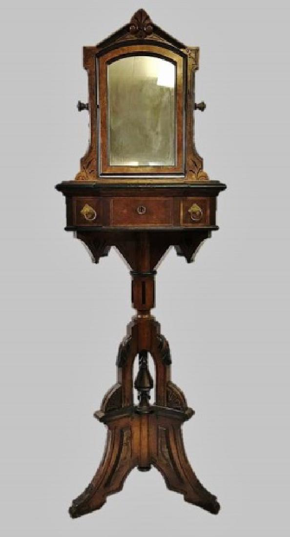 19th C. Eastlake Walnut Shaving Stand and Mirror: Circa 1880 Eastlake wash stand in walnut. Heavily carved tripod base with ebonized wood decoration supporting burl embellished three drawer case with drop pendants . Case with inset polished stone sur