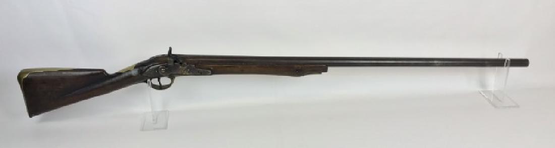 British First Model Brown Bess Musket Percussion: British first model "Brown Bess" percussion conversion musket. Musket heavily modified, cut down stock, replaced ramrod and shortened barrel. Markings are illegible on lock and barrel. Musket measures