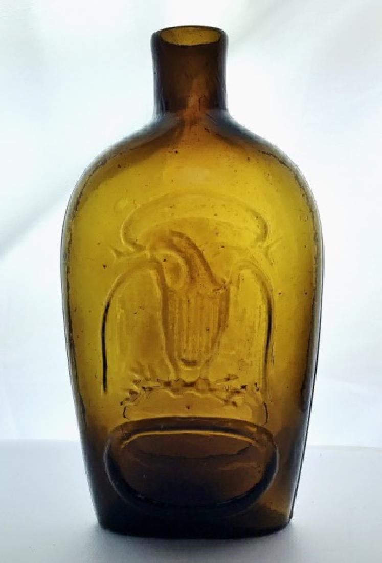 19th C. Historical Flask Double Eagle, Keene NH: Circa 1820 blown pint flask with pontil mark and sheared lip. Flask amber in color, embossed with patriotic eagle on both sides. Likely manufactured at Keene New Hampshire. Exceptional near mint condi