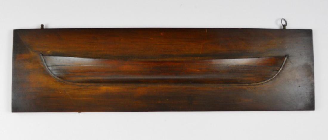 19th C. Carved Ship Builders Half Hull Whaleboat: 19th C. Carved and mounted mahogany ship builders half hull. Model of a whaleboat launch in detail. Original surfaces with age patina. Measures: 6" H x 21.75" L.