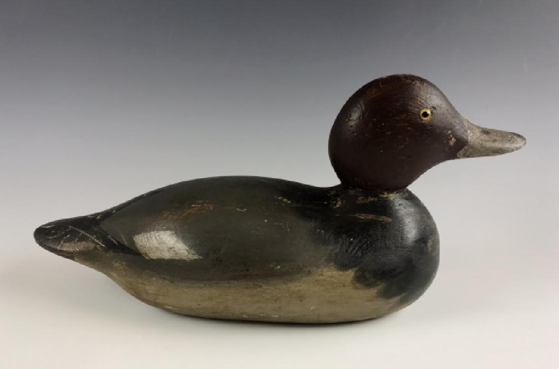 Carved Wood Redhead Duck Decoy, Mason: Mason factory wood redhead duck decoy. Glass eyed decoy in original factory paint with light gunning touchups. Measures: 6.75" H x 13.5" L