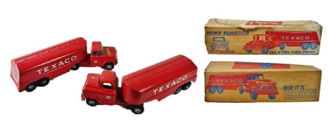 Vintage Toy Texaco Trucks, Boxes, Buddy L (2pc): Two vintage die cast metal toy trucks, Buddy L with original cardboard boxes. Painted metal tractor trailer trucks with "TEXACO" decals. Excellent overall condition, one with original sticker on hood.