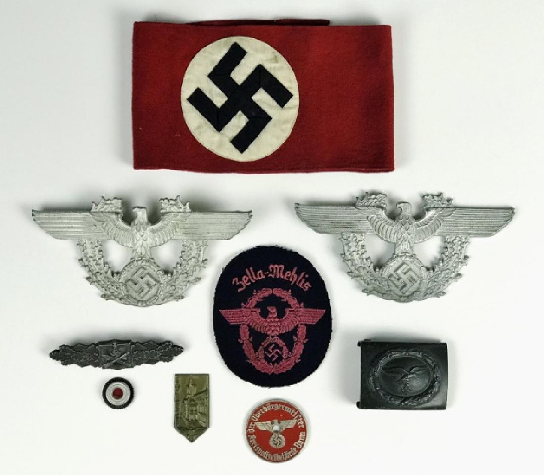 Collection, WW2 German Insignia, (9pc): Nine piece collection of World War Two German insignia: (2) Police shako plates, (1) Police uniform patch, "Bella Mehlis", (1) Police license plate badge, "der Oberburgermeister Kreispolizeibeborde Bo