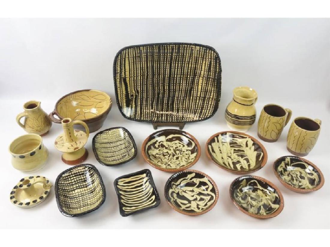 Collection, Williamsburg Pottery, (17pc): Collection of seventeen reproduction 17th and 18th C. pottery pieces, from Williamsburg Pottery and Maloney Pottery. Traditional redware pottery glazed in period designs and colors includes: (1) Large