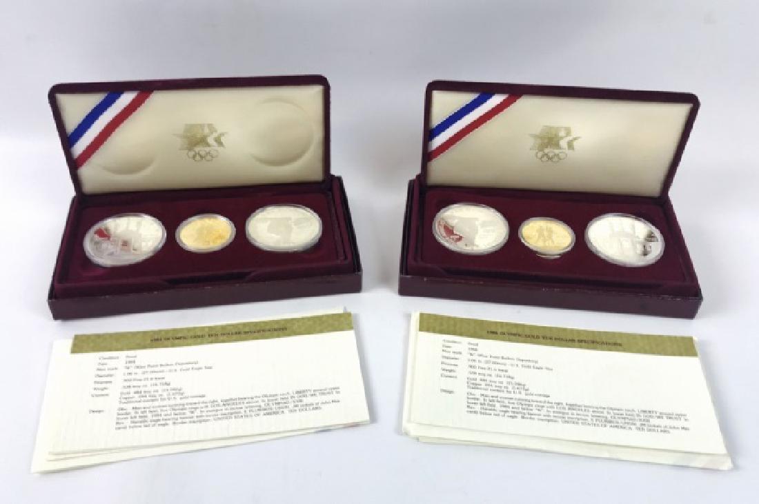 1984 Proof Olympic Gold, Silver Coin Set, (2pc): Two US Mint 1984 Olympic commemorative three coin proof sets. Each set includes two Silver Dollars and one $5 Gold coins. Sets in original packaging with COA's.