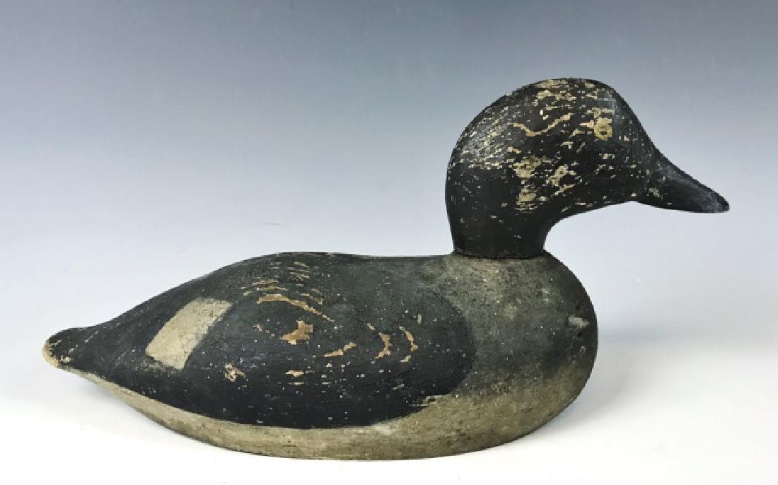 Hand Carved Duck Decoy, Jones River,Kingston MA: 19th C., hand carved and painted Hen Goldeneye duck decoy found at Jones River, Kingston, Massachusetts. Primitive carved hollow base with original surfaces. Measures: 5.75" H x 12.5" L