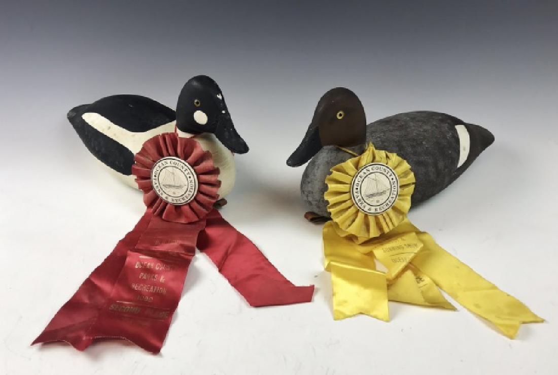 Pair Barnegat Bay NJ Duck Decoys, D. Hall, (2pc): Pair of hand carved and painted Hen and Drake Goldeneye duck decoys, signed D. Hall, with awards. Hollow construction with glass eyes, weight affixed to bass with deep branded signature, "D. HALL". De