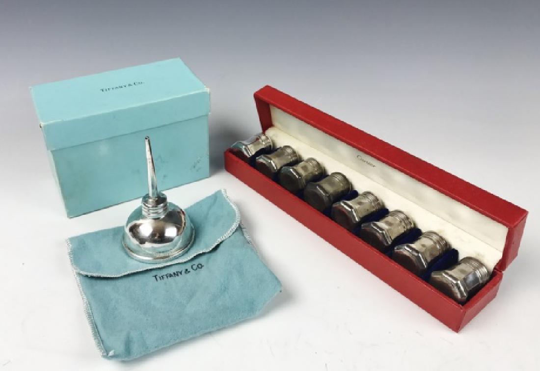 Sterling Silver, Tiffany & Co, Cartier (9pc): Collection of boxed sterling silver items: (1) Vermouth dispenser in two piece oil can form, engraved "1875", signed "TIFFANY & Co", in original box, (8) Salts, signed "CARTIER" in original fitted box