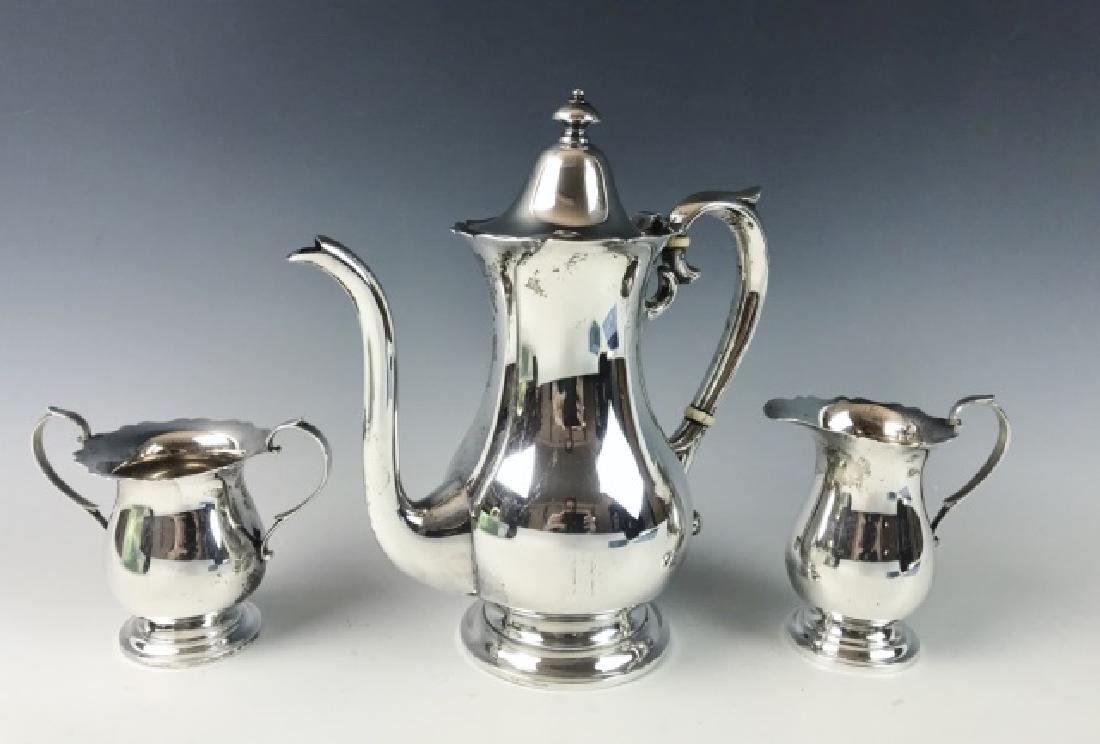Sterling Silver Tea Set, Mueck-Carey, (3pc): Three piece sterling silver tea service, signed " "M" (Mueck-Carey): (1) Tall tea or coffee pot, (1) Sugar, (1) Creamer. Excellent condition with NO MONOGRAMS, Total weight: 27.24 Ozt