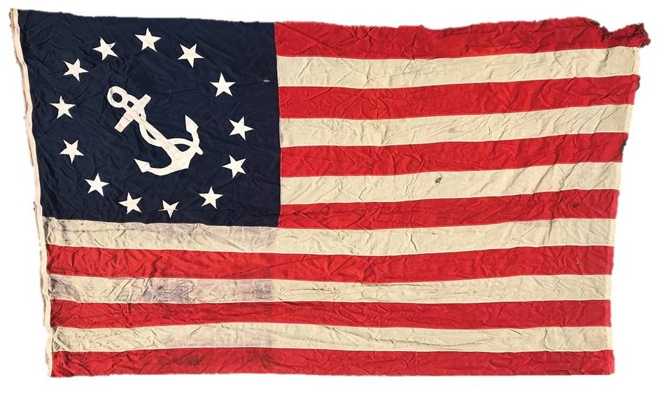 Circa 1900 Sewn American Yachting Flag: Circa 1900 American yachting flag. Machine sewn wool construction with applique fouled anchor in canton surrounded by thirteen stars. Some small holes, staining and loss at upper right hand fly. Measu
