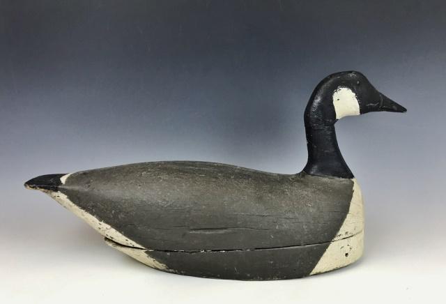 Hand Carved, Painted Wooden Goose Decoy: Antique hand carved and painted Canada Goose decoy. Tack eyed hollow body decoy in period paint, measures: 11.5" H x 9" W x 24" L