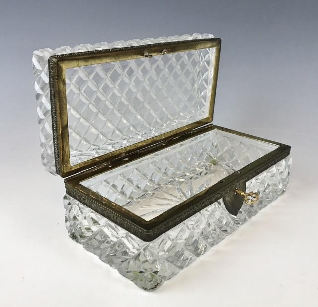 Antique French Cut Crystal Brass Mounted Box: Antique French hinge lidded cut crystal box. Box mounted in brass with functioning lock and key. Measures: 3.25" H x 8.5" W x 4" D.