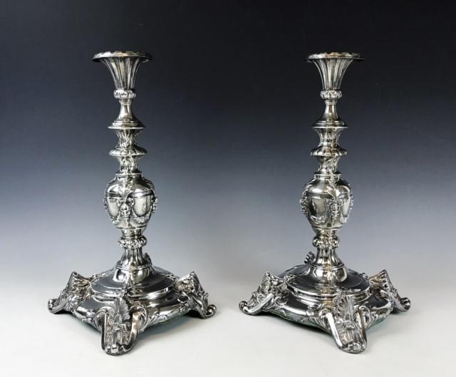 Large Antique Silver Plated Candlesticks, (2pc): Pair of antique French rococo style silver plated candlesticks with swag foliate garlands and grotesque mask decoration. Measure: 14.5" H