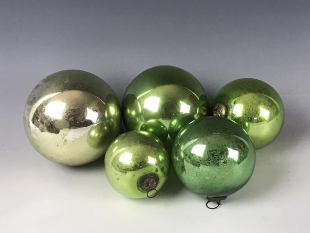 Antique German Mercury Glass Ornaments (5pc): Collection of five antique German, hand blown mercury 'Witches Ball' ornaments. (4) Green, (1) Gold. Largest measures: 5" Dia