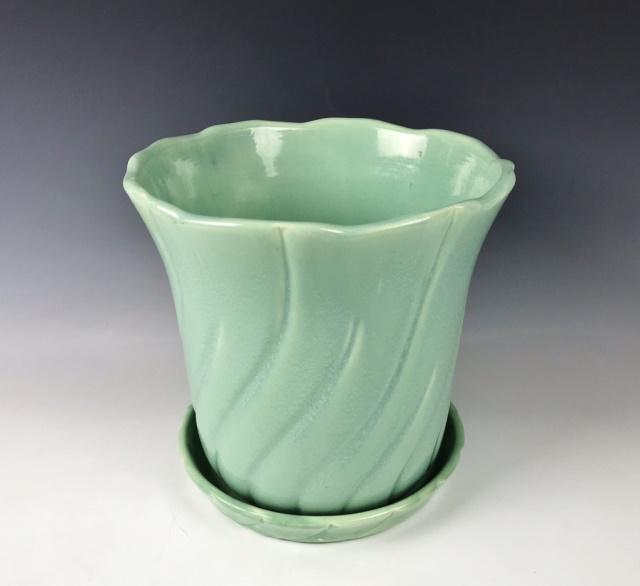 American Pottery Planter, Weller Pottery: Large planter with drainage hole and detached underplate is marked "Weller Pottery since 1842." Swirl design with matte turquoise glaze and measures: 10" H x 10.5" DIA at the opening.