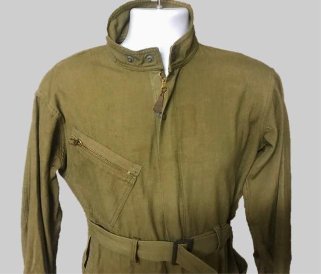 WW2 USAAF Type A-4 Flight Suit: World War Two, US Army Air Forces A-4 flight suit. OD green wool construction with zippered, front-closure, belt, zippered chest and leg pocket. Excellent condition interior stencil, "Elliot".