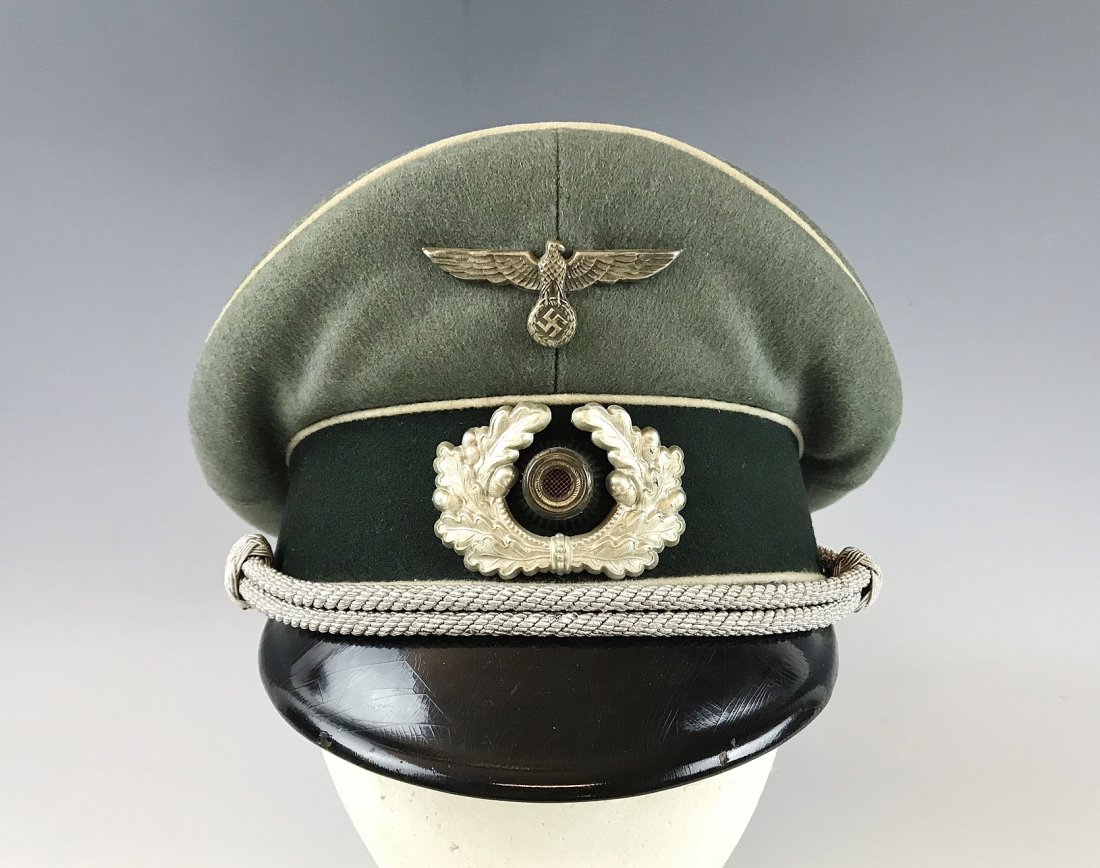 WW2 German Army Officer Visor Cap, EREL: World War Two German army officer's visor cap. High quality "doeskin" wool construction with white waffenfarb (Infantry), and gold silk lined interior. Early style silvered eagle insignia with vented 
