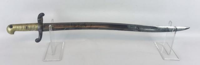 French Model 1842 Yataghan Sword Bayonet: French model 1842 yataghan sword bayonet, spine signed and dated March 1865. Bayonet with single fullered curved steel blade. Steel guard with proofs and serial number, heavy cast brass hilt. Bayonet 