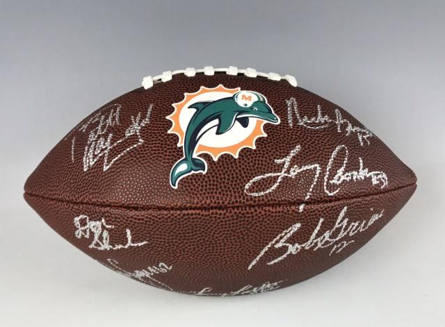 1973 Miami Dolphins Team Autographed Football: 1972-1973 Miami Dolphins team autographed football. Perfect season (17-0) players, autographs in silver ink include: Larry Little, Bob Griese, Larry Csonka, Nick Buoniconti, Paul Warfield, Jim Langer,
