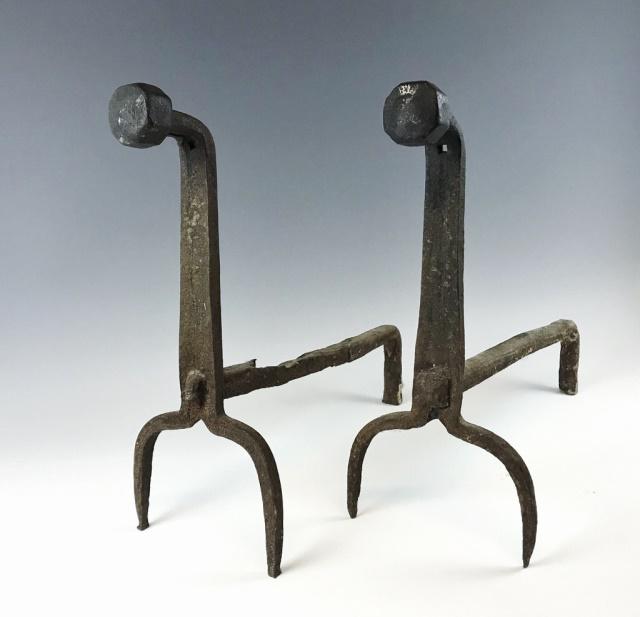 17th C. Hand Forged Iron Fireplace Andirons, (2pc): 17th C. hand made wrought iron fireplace andirons. Early form with faceted heads and peened supports. Good solid working condition with surface oxidation. Andirons measure: 16" H x 7" W x 18.5" D